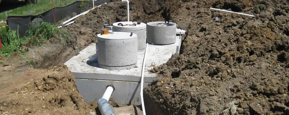 Septic system repair and installation site with tank access ports in Dayton, OH